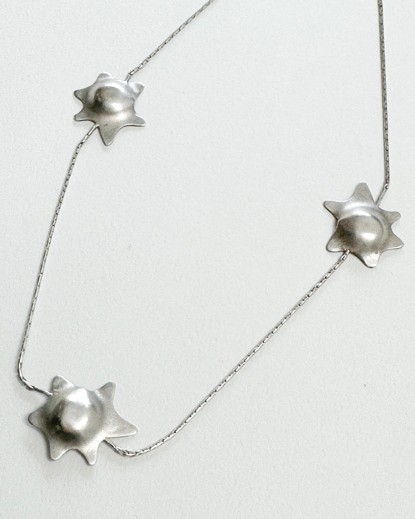 MELTED STARS NECKLACE